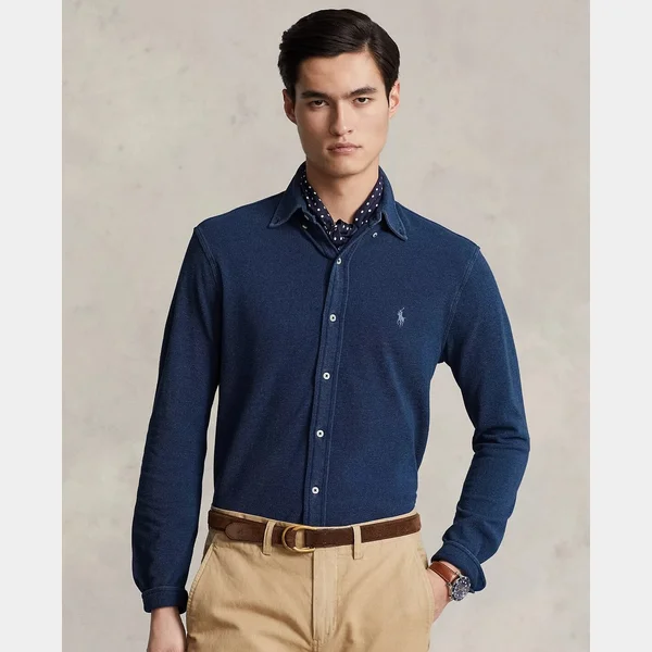Full navy-shirt photo fitted inside a square, with space beside the portrait